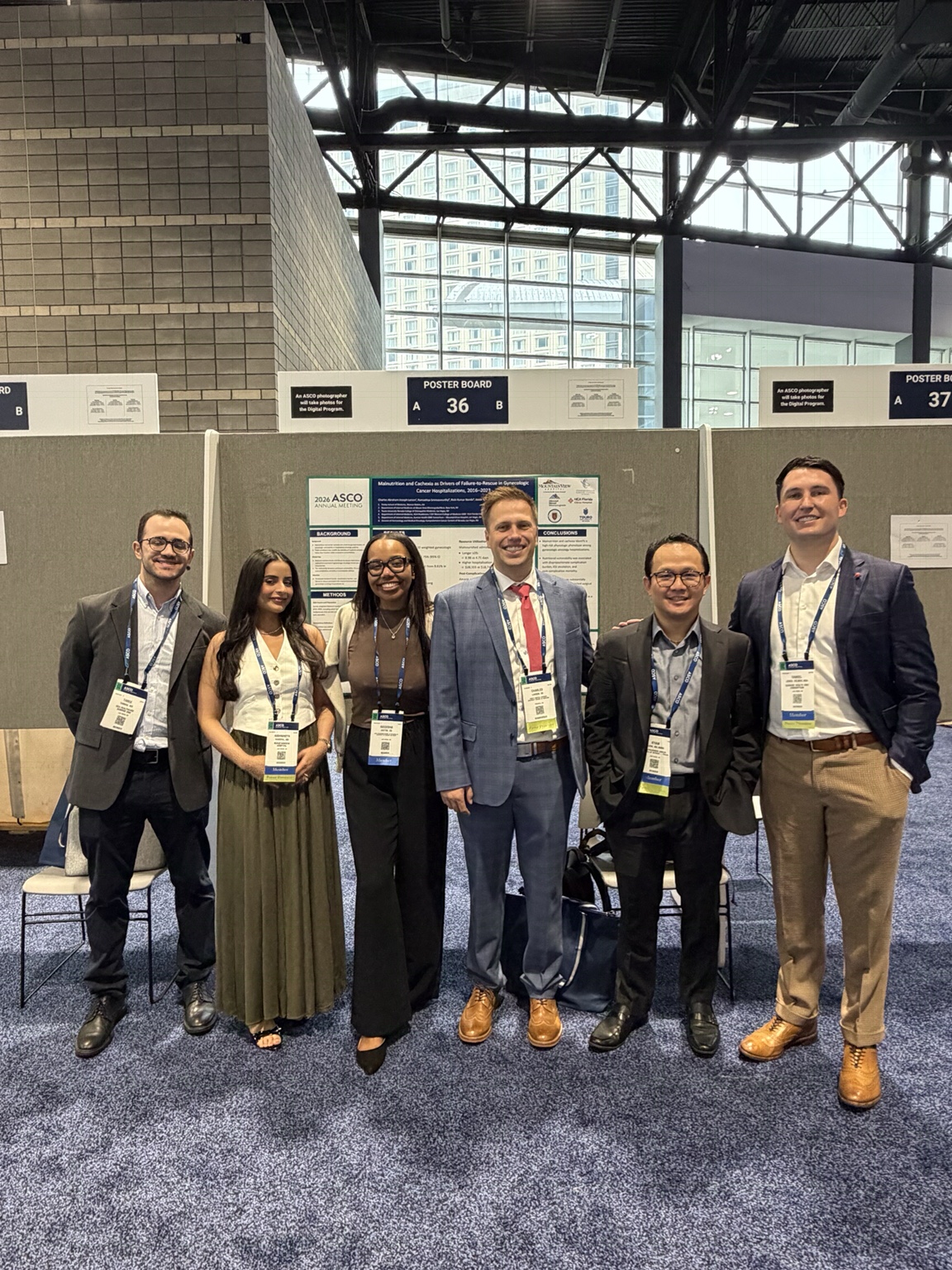 Daniel Jones and oncology research colleagues at an ASCO poster presentation